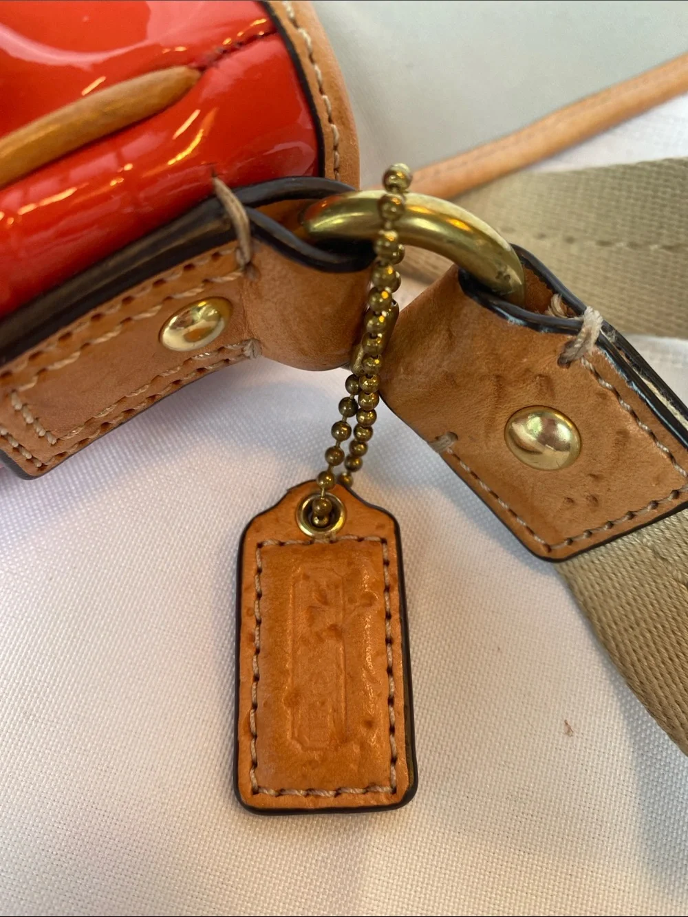 Coach Peyton Patent Crossbody Bag in Glossy Orange with Tan Trim
